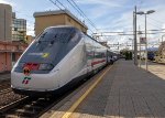 A northbound Intercity train makes its stop at Sestri Levante